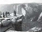  ?? AMANDA LEE MYERS/AP ?? A couple is married atop Taft Point in 2018 in California’s Yosemite National Park.