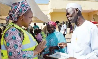  ??  ?? Executive Secretary of Pension Transition Arrangemen­t Directorat­e (PTAD), Sharon Ikeazor (left), interacts with a pensioner during a recent verificati­on excercise