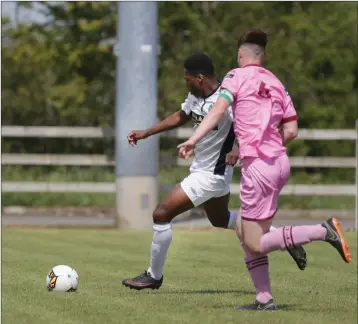  ??  ?? Precious Omochereof Bray Wanderers is chased by Kyle Scallan of Wexford FC.