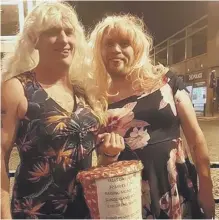  ??  ?? Dave Potter, left, and John Kelly who went out in Sunderland on Boxing Day wearing women’s clothing after completing their 32-mile charity walk on Christmas Day.