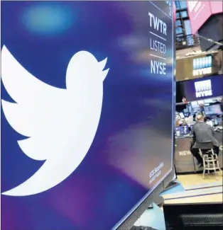  ?? AP PHOTO ?? The logo for Twitter is displayed above a trading post on the floor of the New York Stock Exchange on Feb. 8.