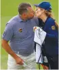  ??  ?? EARLY PRIZE – Lee Westwood kisses his caddie and girlfriend Helen Storey on the 18th hole during the third round of the Arnold Palmer Invitation­al Presented by MasterCard at the Bay Hill Club and Lodge yesterday in Orlando, Florida. (AFP)