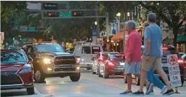  ?? JOHN MCCALL/SOUTH FLORIDA SUN SENTINEL ?? Atlantic Avenue is crowded on Tuesday in Delray Beach. Residents, visitors and business owners are worried about increasing noise.