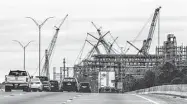  ?? Michael Ciaglo / Houston Chronicle ?? Cranes mark the Chevron Phillips Chemical refinery expansion off Interstate 10 in Baytown.