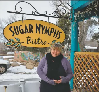  ?? ?? Co-owner Ki Holste stands in front of her restaurant, Sugar Nymphs Bistro in Peñasco.