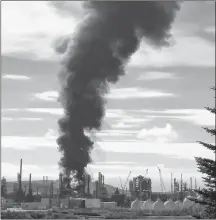  ?? CP PHOTO ?? A fire and plume of smoke rises from an Irving Oil refinery in Saint John, N.B., last month.