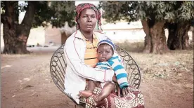  ??  ?? DISPLACED: Josiane Wankian, 37, mother of nine, fled Betokomia, north-west of Central African Republic, with her children after an armed group attacked their village. Her husband had fled shortly before when he heard rumours of attacks. She hasn’t...