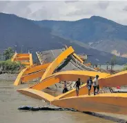  ?? Photo: Reuters ?? A road bridge in ruins after it was hit by an earthquake and tsunami in Palu, Sulawesi island, Indonesia, in October last year.