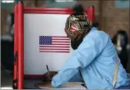  ?? ASSOCIATED PRESS FILE PHOTO ?? In this Tuesday, Nov. 3, file photo, Johnea Barlow casts her ballot at the Kentucky Center for African American Heritage, on Election Day in Louisville, Ky.