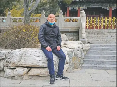  ?? (AP/Ng Han Guan) ?? Shi Jinjie, a tour guide in Beijing, poses for a photo at the Jingshan park in Beijing.