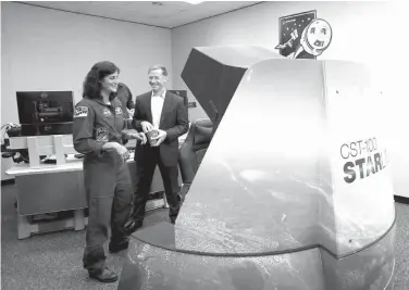  ?? The Galveston County Daily News via AP ?? NASA astronaut Suni Williams talks with Chris Ferguson, deputy manager of Boeing’s commercial crew program and director of crew and mission operations, about the CST-100 Starliner training simulators Wednesday at the Johnson Space Center in Houston.