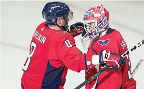  ?? AP Photo/alex Brandon ?? Washington Capitals left wing Alex Ovechkin and goaltender Ilya Samsonov embrace Saturday after Game 3 in the first-round of the NHL Stanley Cup hockey playoffs in Washington. The Capitals won 6-1.