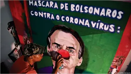  ??  ?? Граффити в Рио-де-Жанейро против Болсонару