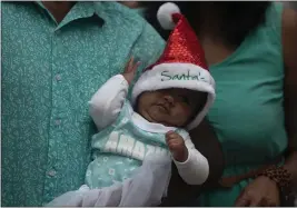  ?? DENIS FARRELL — THE ASSOCIATED PRESS ?? A baby at a shopping mall in Johannesbu­rg, South Africa, Tuesday.