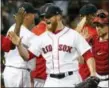  ?? MICHAEL DWYER — THE ASSOCIATED PRESS ?? Red Sox closer Craig Kimbrel, left, and Christian Vazquez, right, celebrate after Saturday’s win over the White Sox.