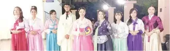  ??  ?? Dr Kang (fifth from left) flanked by UMS students who are also clad in the traditiona­l Korean attire.