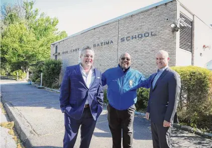  ?? Jarret Liotta / For Hearst Connecticu­t Media ?? Posing with the Rev. Reggie Norman at center, Andrew McLaughlin, left, and Carlo Schiattare­lla are looking forward to turning the former Our Lady of Fatima School into a new private school.