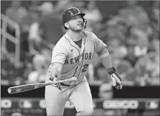  ?? LYNNE SLADKY/AP PHOTO ?? New York Mets first baseman Pete Alonso watches after hitting a solo home run during the second inning of Saturday’s game against the Miami Marlins in Miami. He also homered in the eighth inning.