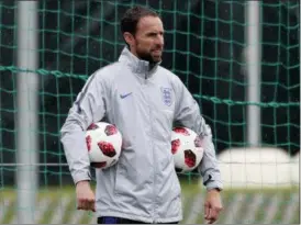  ?? DMITRI LOVETSKY — ASSOCIATED PRESS ?? England head coach Gareth Southgate watches his team practice in Zelenogors­k near St. Petersburg, Russia, last Wednesday.