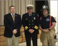  ??  ?? Bradford Heights Elementary School Principal Andrew Hoffert, West Bradford Fire Chief Jaw Law and West Bradford firefighte­r Jim Kelch pose together during the Patriots Day ceremony to honor those who died in the terrorist attacks 17 years ago.