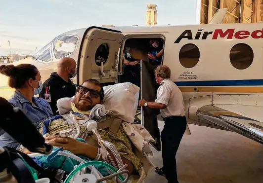  ?? Courtesy Craig Ainsworth ?? A medical transport team prepares to transfer John Vargas Jr. from San Antonio to Gainesvill­e, Fla., on Aug. 19 to be evaluated for a double lung transplant.