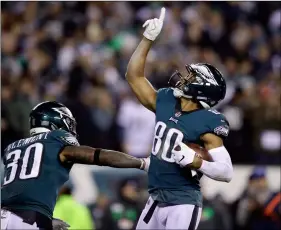  ??  ?? Philadelph­ia Eagles’ Jordan Matthews (80) celebrates with Corey Clement (30) after a touchdown during the second half of an NFL football game against the Washington Redskins, on Monday, in Philadelph­ia. AP Photo/MAtt RouRke