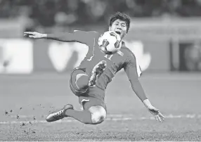  ?? KIMIMASA MAYAMA/EPA-EFE ?? North Korean forward Jong Il-gwan takes it to Japan at the East Asian Football Federation championsh­ip in 2017 in Tokyo. South Korea tried to reach out to its reclusive neighbor through their mutual love of soccer.