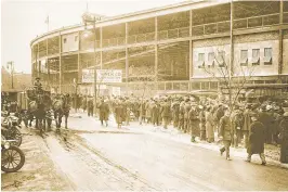  ?? PHOTO COURTESY OF THE CHICAGO HISTORY MUSEUM ?? This May 14, 1914, photo shows crowds lining up outside Weeghman Park in Chicago. The park was renamed Wrigley Field in 1927.