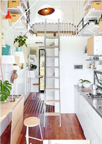  ??  ?? The Pod (above) has a circular window at the mezzanine level, so you can lie in bed and see the sky. Although tiny, the stainless-steel kitchen has everything you need, including a dishwasher. Clever lighting (right) takes up minimal space