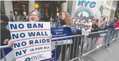  ?? — Reuters ?? Protesters demonstrat­e near Trump Tower against US President Donald Trump in the Manhattan borough of New York City.