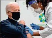  ?? Alex Edelman/AFP/TNS ?? US President-elect Joe Biden receives a COVID-19 vaccinatio­n from Tabe Masa, nurse practition­er and head of Employee Health Services, at the Christiana Care campus in Newark, Delaware, on Dec. 21.