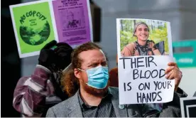  ?? Photograph: Erik S Lesser/EPA ?? A protester holds a photograph of environmen­tal activist Manuel Esteban Paez Terán outside Atlanta City Hall on 31 January.