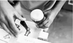  ??  ?? A worker drafts a glass of craft beer from a pump in a beer garden at the garage of Social Club brewery in Caracas, Venezuela. — Reuters photo