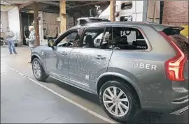  ?? Eric Risberg Associated Press ?? GEORGETOWN business professor Marlene Towns says convincing people that driverless cars will cause fewer deaths “will be tough.” Above, an Uber robot car.