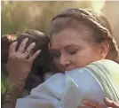  ?? LUCASFILM ?? General Leia Organa (Carrie Fisher) hugs Rey in a moving moment from “The Rise of Skywalker.”