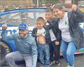  ?? Adam Carey ?? Double-liver transplant recipient Thiago Cruz, older brother Gioanni and mother Yesenia shows off his scars and his strength, next to NASCAR drive Ross Chastain on Friday morning at AdventHeal­th Redmond.