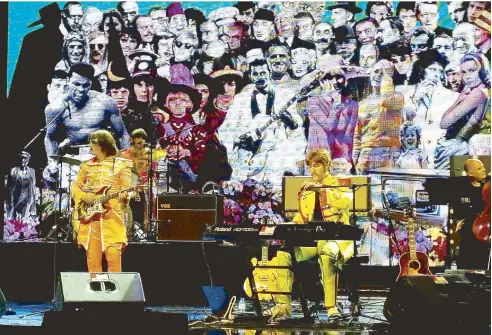  ?? costumes ?? Bootleg Beatles appearing in Sgt. Pepper’s Lonely Hearts Club Band