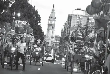  ?? AGENCE FRANCE PRESSE ?? Pedi-cabs decorated with lanterns line up before the grand opening of Chinese artist Cai Guo-Qiang's latest work “Fireflies” in Philadelph­ia, Pennsylvan­ia.