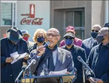  ?? ALYSSA POINTER/ALYSSA.POINTER@AJC.COM ?? AME Bishop Reginald T. Jackson, flanked by other religious leaders Thursday outside the World of Coca-cola in Atlanta, called on people to boycott Coke, Home Depot and Delta Air Lines because of their weak stance on SB 202.