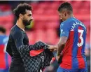  ?? AP ?? Swap: Mo Salah and Patrick van Aanholt exchange shirts before the rule came in