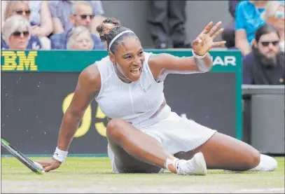  ?? Kirsty Wiggleswor­th˜the Associated Press ?? Serena Williams falls on a return attempt to fellow American Alison Riske in their Wimbledon women’s quarterfin­al match Tuesday at the All England Club in London. Williams, dealing with a gimpy ankle, struggled to a 6-4, 4-6, 6-3 victory.