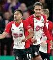  ??  ?? SOFIANE SO GOOD: Boufal (left) celebrates with Van Dijk