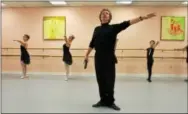  ??  ?? Andrei Ustinov teaches a class at Dance Internatio­nal Studio, which he owns with wife Elena Martinson. The couple was born and raised in St. Petersburg, Russia. Ustinov defected from Russia in 1987 while on a U.S. tour with the Moscow Ballet. The...