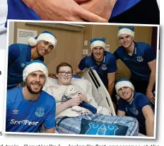  ?? GETTY IMAGES ?? Blue Christmas: Sigurdsson (bottom left) and teammates deliver festive cheer at Alder Hey