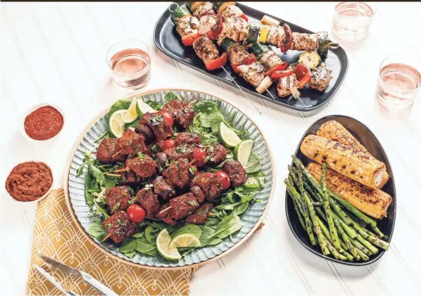  ?? EBERLY FILM LABS/THE DAILY MEAL/TNS ?? Turkey and vegetable kebabs and smoky beef and mushroom kebabs are perfect for your Memorial Day cookout.