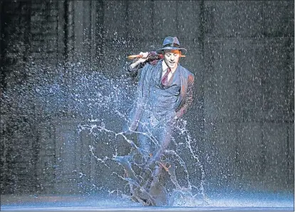  ??  ?? ON A (RAIN) CLOUD: Grant Almirall performs the iconic dance scene in the Pieter Toerien production