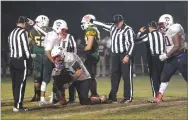  ??  ?? Strathmore High School's Lucas Raya recovers a fumble at the end of fourth quarter.