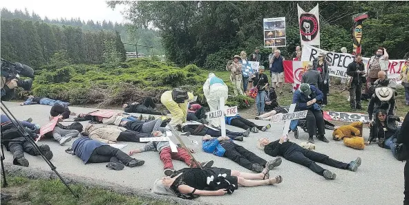  ??  ?? A crowd of protesters staged a “die-in” at Kinder Morgan’s facility in Burnaby on Wednesday to illustrate some of the risks of the polarizing Trans Mountain project. It was the same day the federal government announced measures to ensure the pipeline...