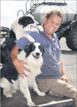  ??  ?? GOOD TIMES: Natimuk farmer Brian Klowss with dogs Ellie and Oscar, finished his harvest season with ‘well above average’ results. Picture: PAUL CARRACHER