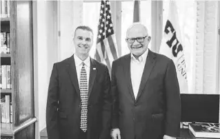  ?? FIU ATHLETICS ?? FIU President Mark B. Rosenberg, right, announced UCF deputy AD Scott Carr, left, has been named the new AD at FIU.